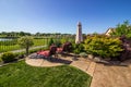 Lounge Chairs Overlooking Green Field & Blue Pond Royalty Free Stock Photo