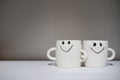 Two lovely cups on white table. Concept about relationship and l