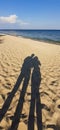 Two lovers on the beach. male and female shadow hugging on the beach