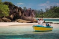 Two lovers and a boat on the paradise Seychelles