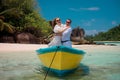 Two lovers and a boat on the paradise Seychelles