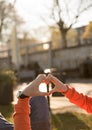 two lovers hold hands. sunny day walk. heart Royalty Free Stock Photo