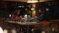 Two lovers take photo using mobile phone in restaurant. Couple enjoy dinner date Royalty Free Stock Photo