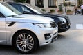 Two Luxurious SUVs Parked In Front Of Monte Carlo Casino In Mona