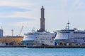 Two luxury Cruise Ships in front of the lighthouse in Genoa, Italy Royalty Free Stock Photo