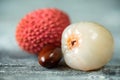 Two lychee fruits wooden background Royalty Free Stock Photo