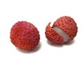 Two lychee fruits with white flesh on a white background Royalty Free Stock Photo