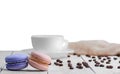 Two macaroons with cup coffee beans Royalty Free Stock Photo