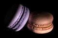 Two macaroons darkened in black