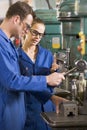 Two machinists working on machine Royalty Free Stock Photo
