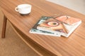 Magazines and coffee mug on the table, real photo Royalty Free Stock Photo