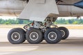 Two main landing gear with tires, view under the aircraft fuselage