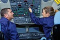 two maintenance engineers inside airplane Royalty Free Stock Photo