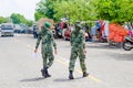 Two Maldivian military women crossing street