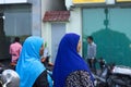 Two maldivian women with a blue veil muslim religion