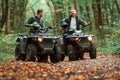 Two male atv riders is in the forest together Royalty Free Stock Photo