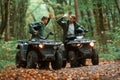 Two male atv riders is in the forest together Royalty Free Stock Photo