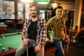 Two male billiard players with cues poses Royalty Free Stock Photo