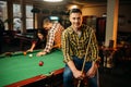 Two male billiard players with cues poses Royalty Free Stock Photo