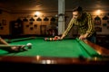 Two male billiard players leisures in poolroom Royalty Free Stock Photo