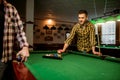 Two male billiard players places colorful balls Royalty Free Stock Photo