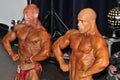 Two male bodybuilders showing their chest pose