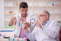 Two male chemists working at the lab