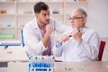 Two male chemists working at the lab