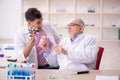 Two male chemists working at the lab