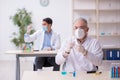 Two male chemists working at the lab during pandemic Royalty Free Stock Photo