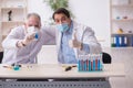 Two male chemists working at the lab during pandemic Royalty Free Stock Photo