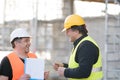 Two male civil engineers at work