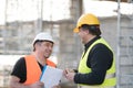 Two male civil engineers at work