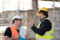 Two male civil engineers at work