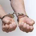 Two male hands handcuffed
