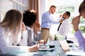 Two Male Colleagues Fighting In Office Royalty Free Stock Photo