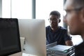 Two male colleagues  working in a creative office, close up, selective focus Royalty Free Stock Photo