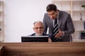 Two male colleagues working in the office Royalty Free Stock Photo