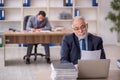 Two male colleagues working in the office Royalty Free Stock Photo