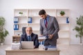 Two male colleagues working in the office Royalty Free Stock Photo