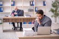 Two male colleagues working in the office Royalty Free Stock Photo