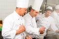 Two male cook work in professional kitchen Royalty Free Stock Photo