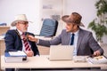 Two male cowboy employees in funny concept Royalty Free Stock Photo