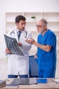 Two male doctors radiologists working in the clinic