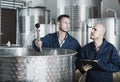 Two male employees at winery