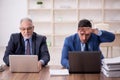 Two male employees working in the office Royalty Free Stock Photo