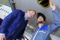 two male engineers inspecting aircraft Royalty Free Stock Photo
