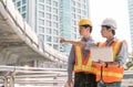 Two engineers discuss about the projects and construction site Royalty Free Stock Photo