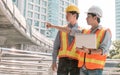 Two engineers discuss about the projects and construction site Royalty Free Stock Photo