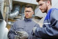 two male engineers with vernier gauge